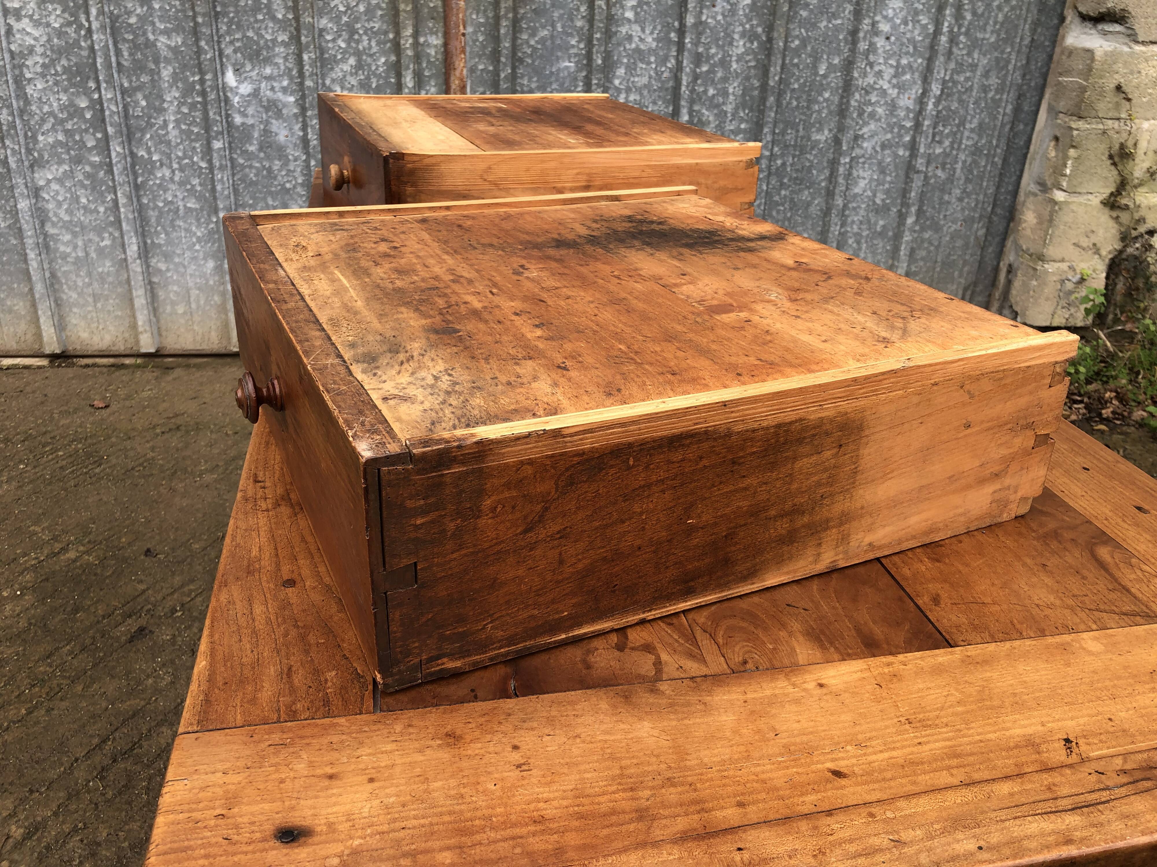 Antique solid cherry farmhouse table with 2 end drawers and 1 pull-out.