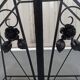 Pink-decorated iron umbrella door.