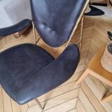 Black and golden bronze designer armchair