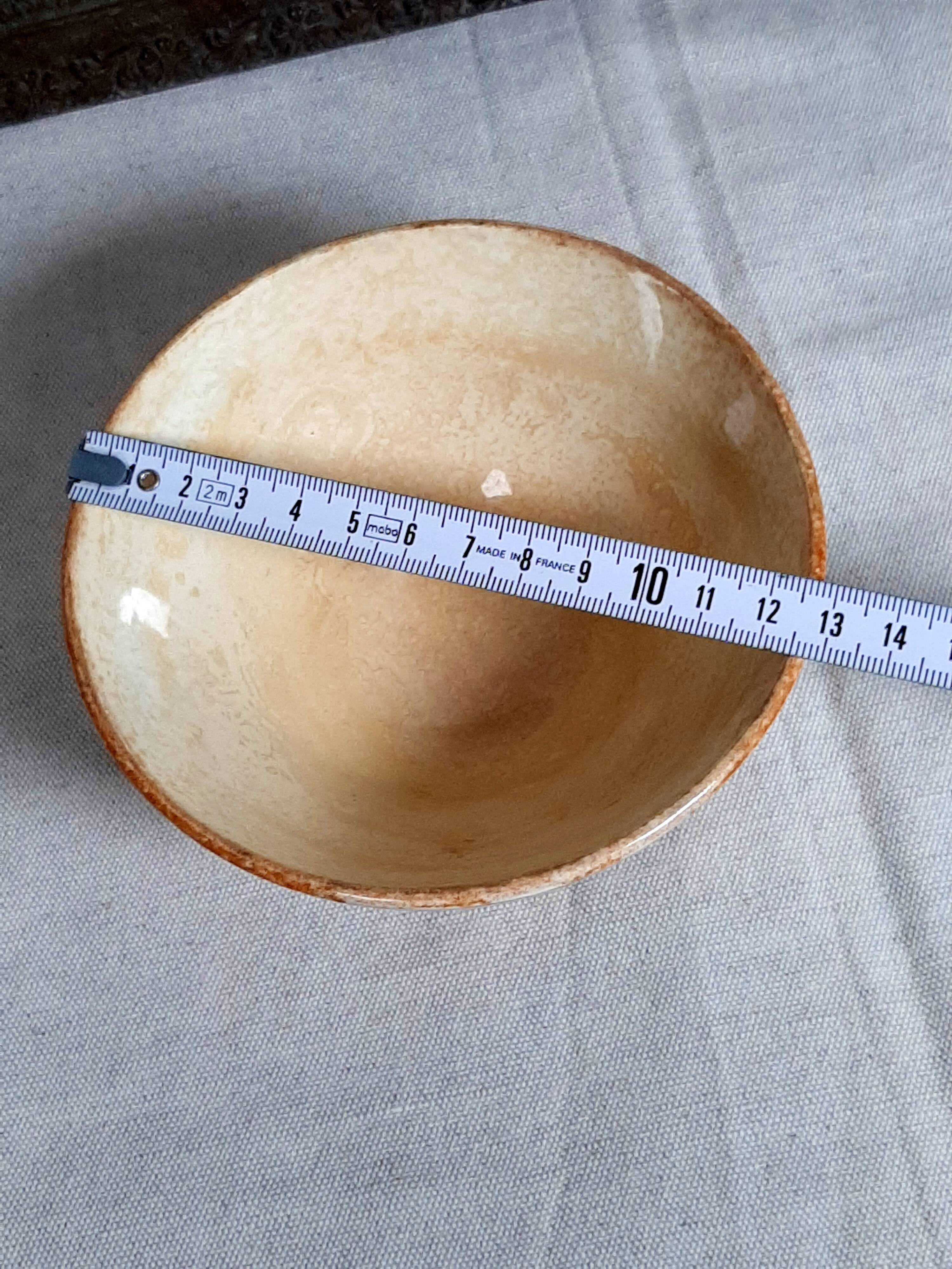 Old bowl in earthenware with floral decoration.