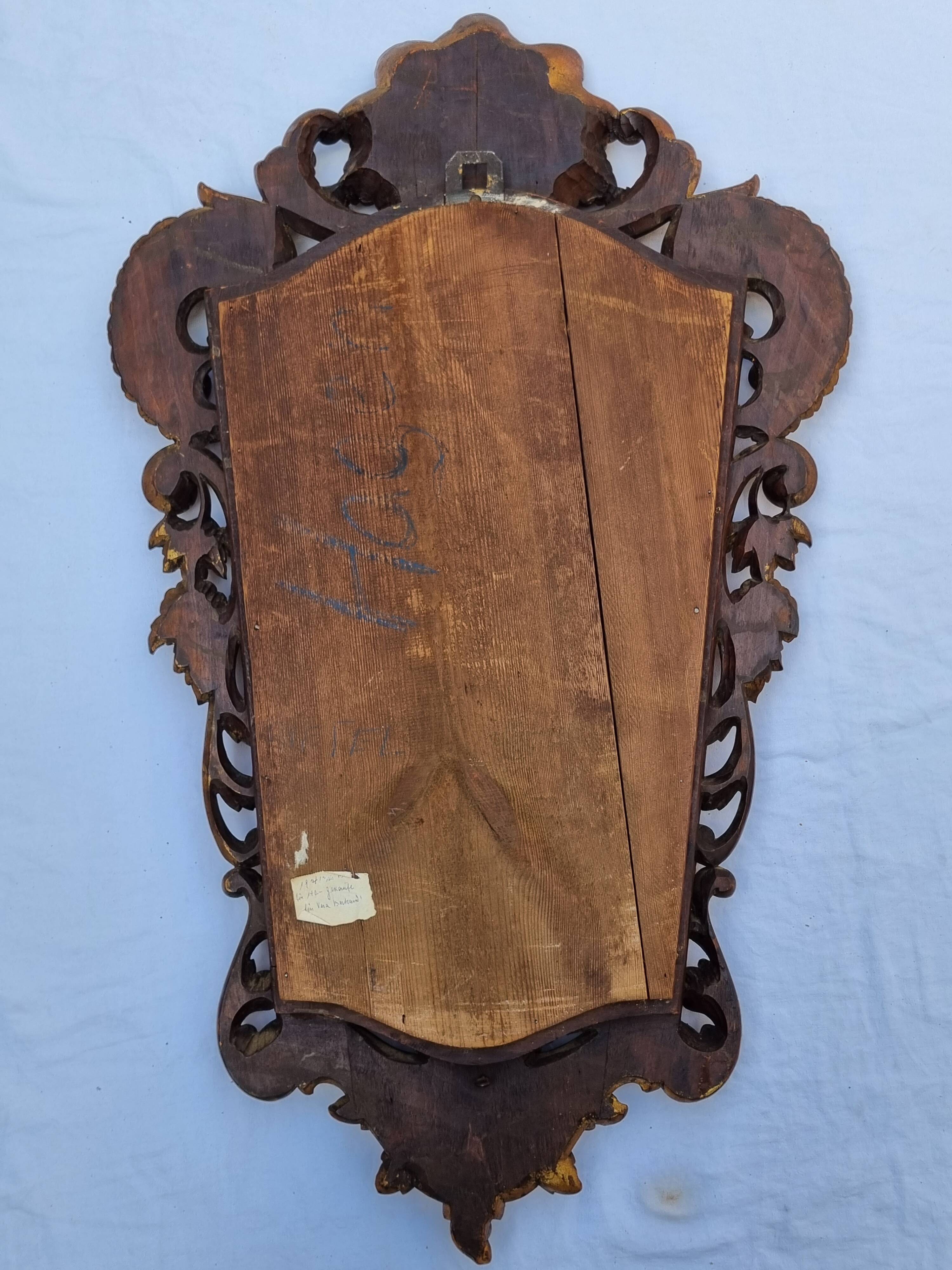 Antique wall mirror in carved gilded wood, Louis XV style, 19th century, 98 x 57 cm.