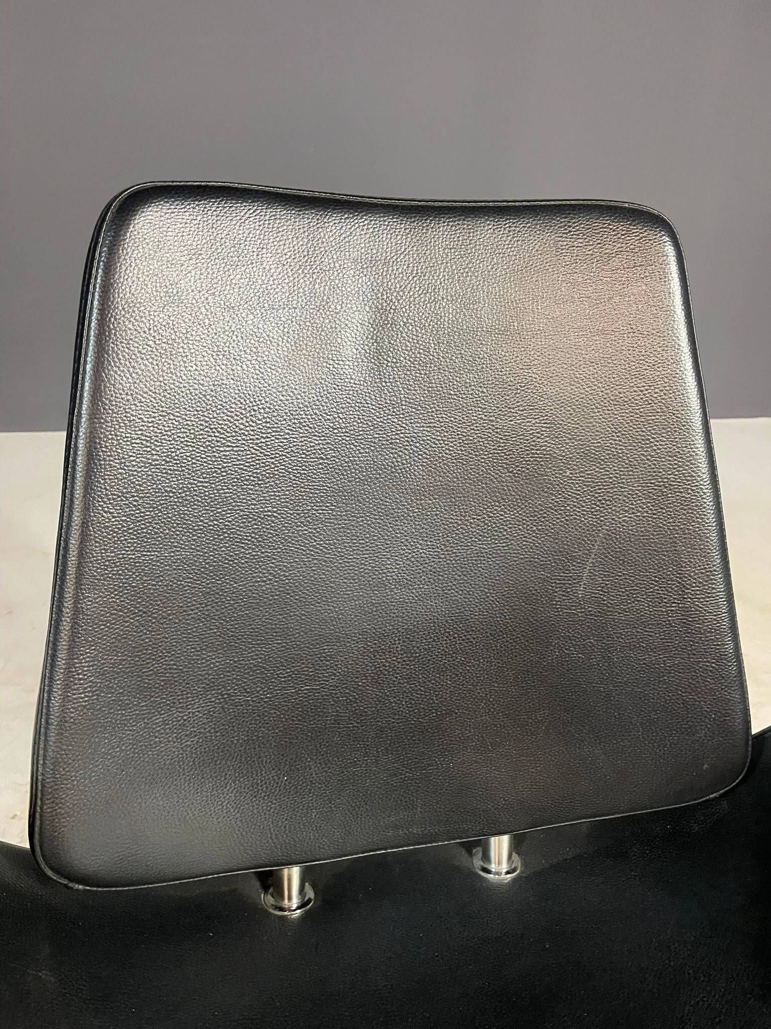 Alipes black swivel salon chair with chrome star base by Giorgetto Giugiaro
