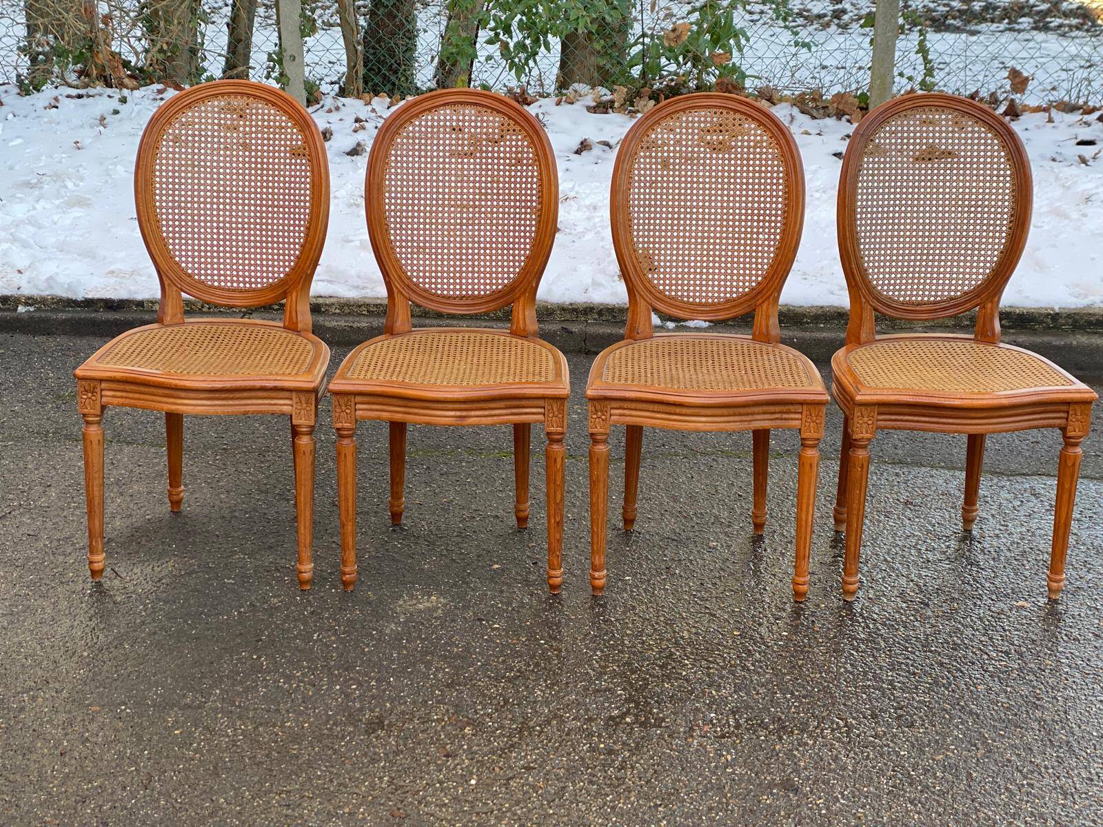 4 caned Louis XVI medallion dining chairs from the 19th century.
