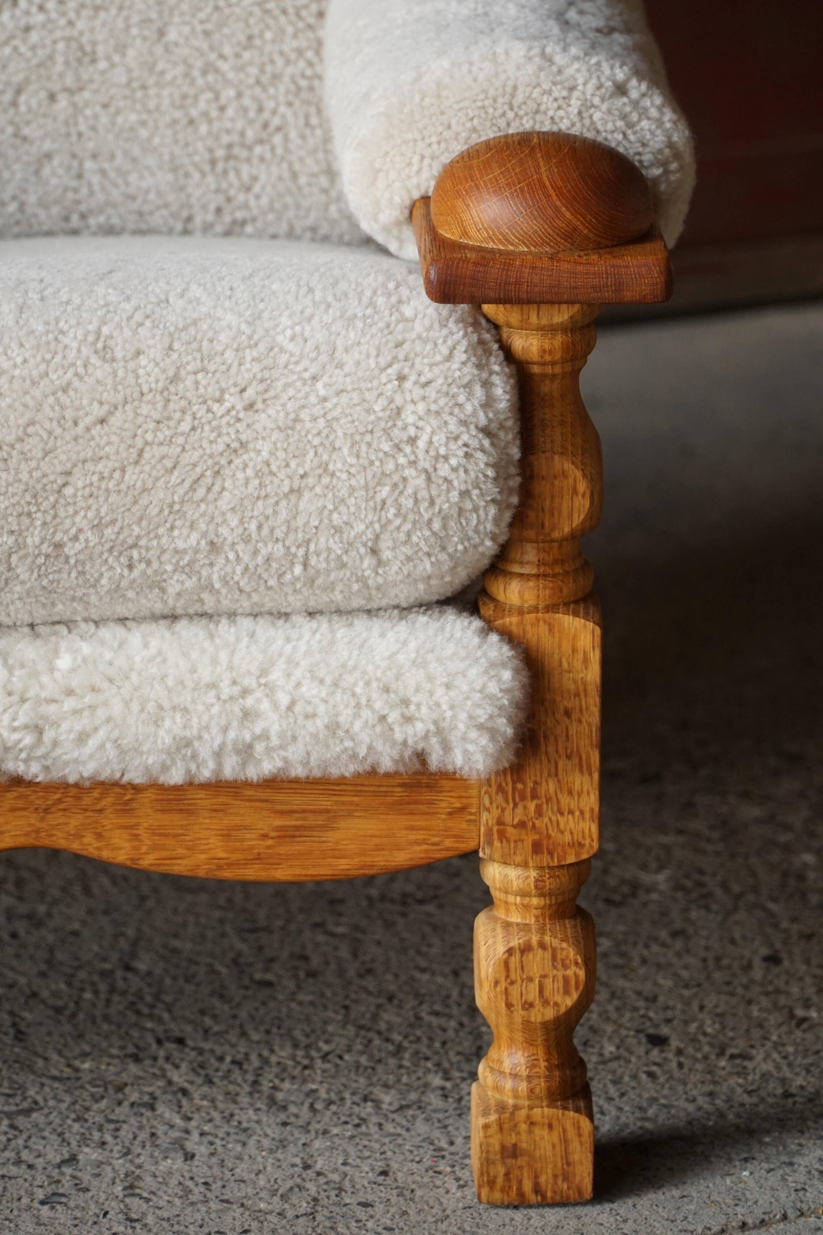 Henning Kjærnulf, lounge chairs in oak and lambswool, mid-century Danish, 1960s.