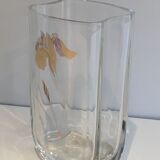 Glass vase with a decoration of a golden flower, around 1970.