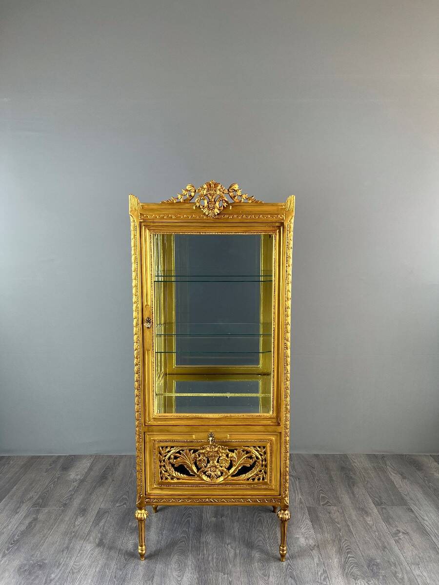 Carved and gilded wooden display cabinet, Louis XVI style, 20th century.