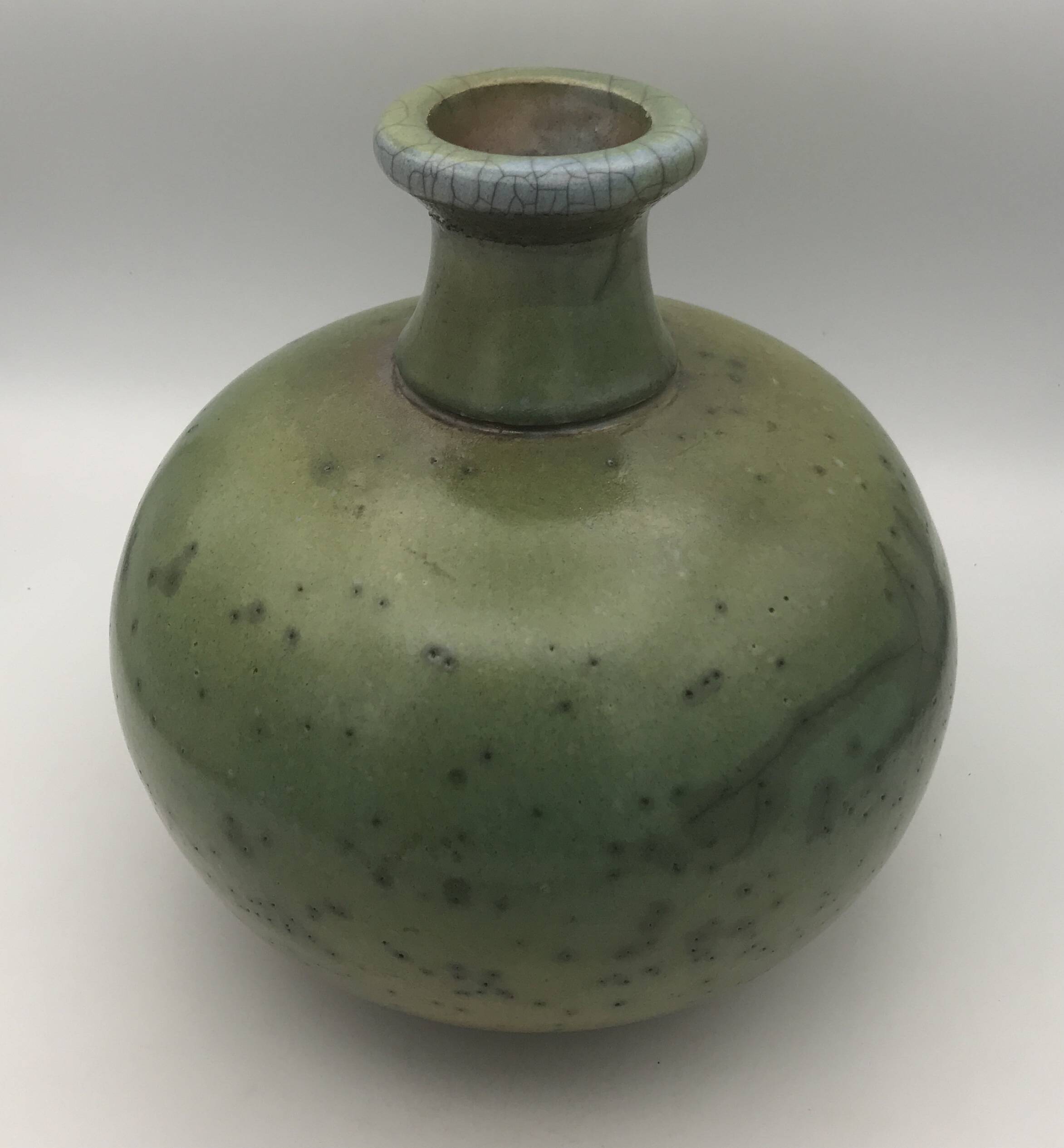 Contemporary vase ball shape raku shades of green and yellow
