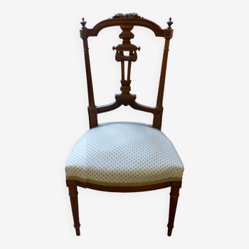 Upholstered chair in wood sulpte molding