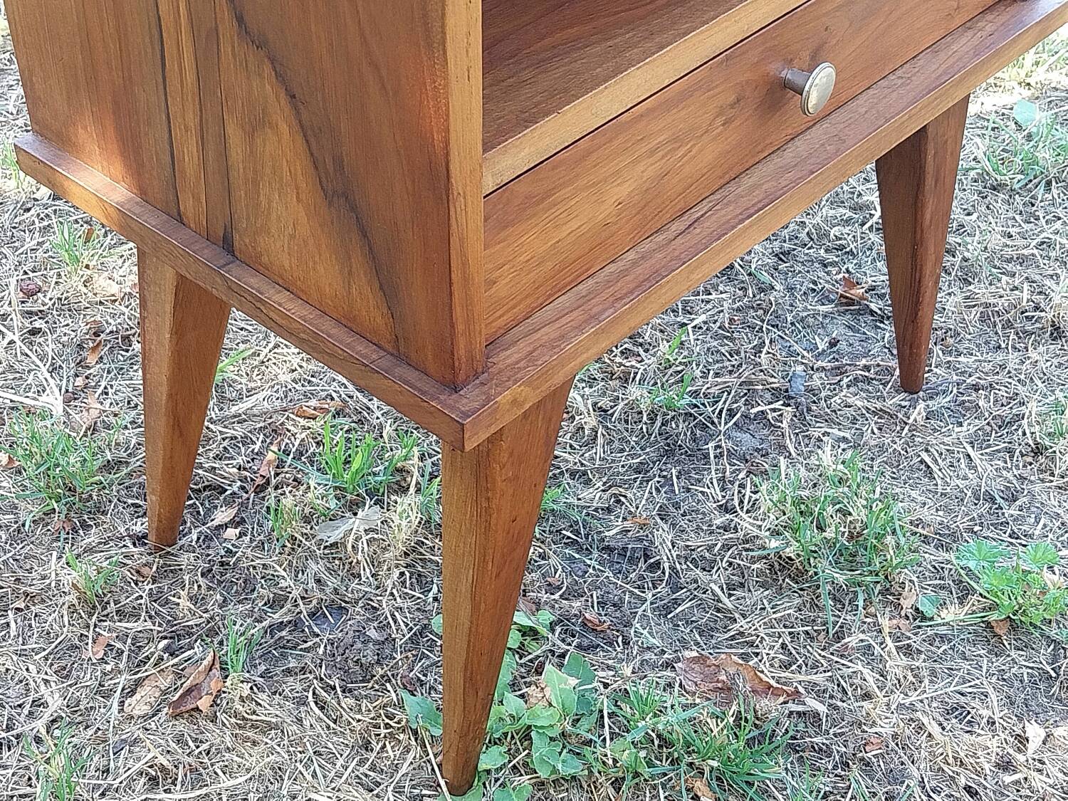 Wooden bedside table with compass feet