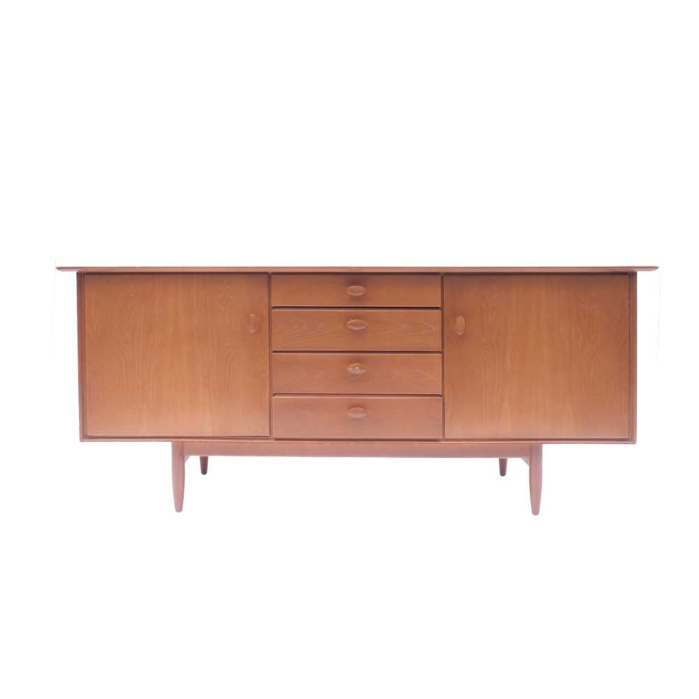 Vintage Scandinavian sideboard with an overflowing top.