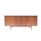 Vintage Scandinavian sideboard with an overflowing top.