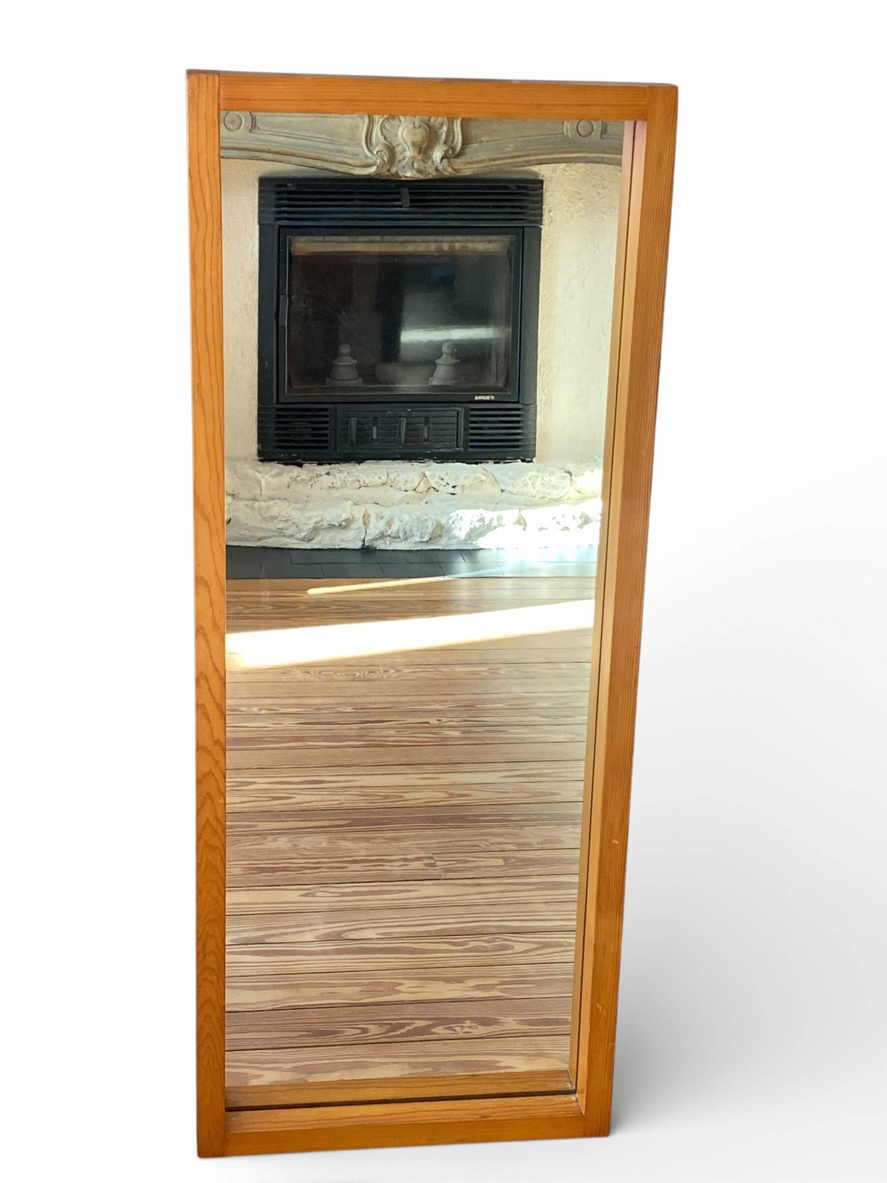 Modernist mirror in solid elm from the 1950s.