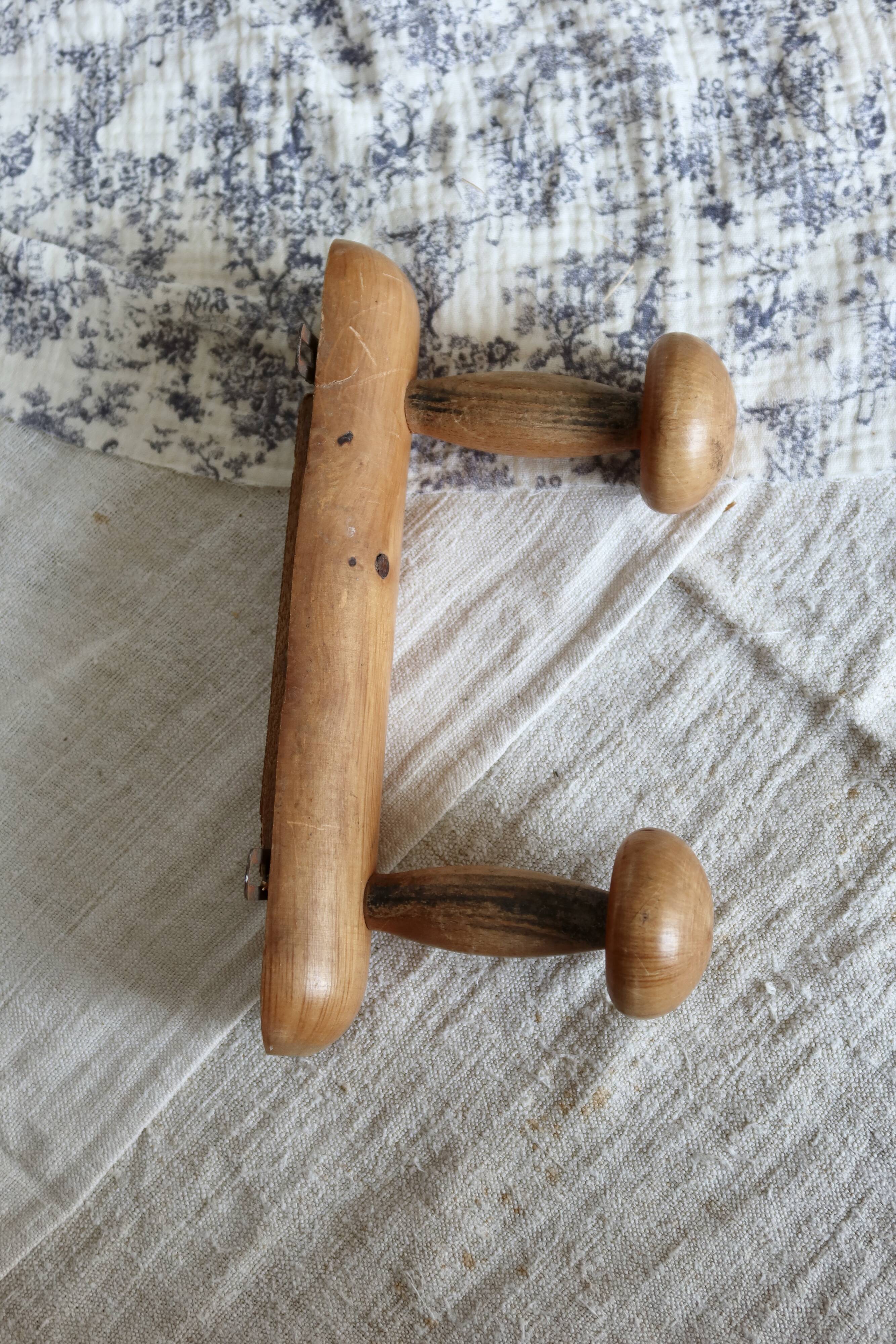 Antique wooden coat rack with two round hooks