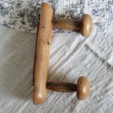 Antique wooden coat rack with two round hooks