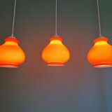 Trio of vintage orange opaline pendant lights, 1960-70
