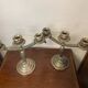 Pair of art deco style candle holders in silver metal