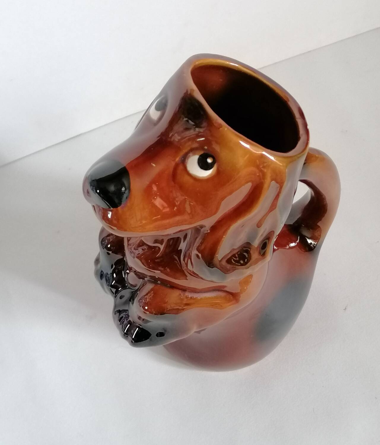 Zoomorphic dachshund dog pitcher in majolica slip