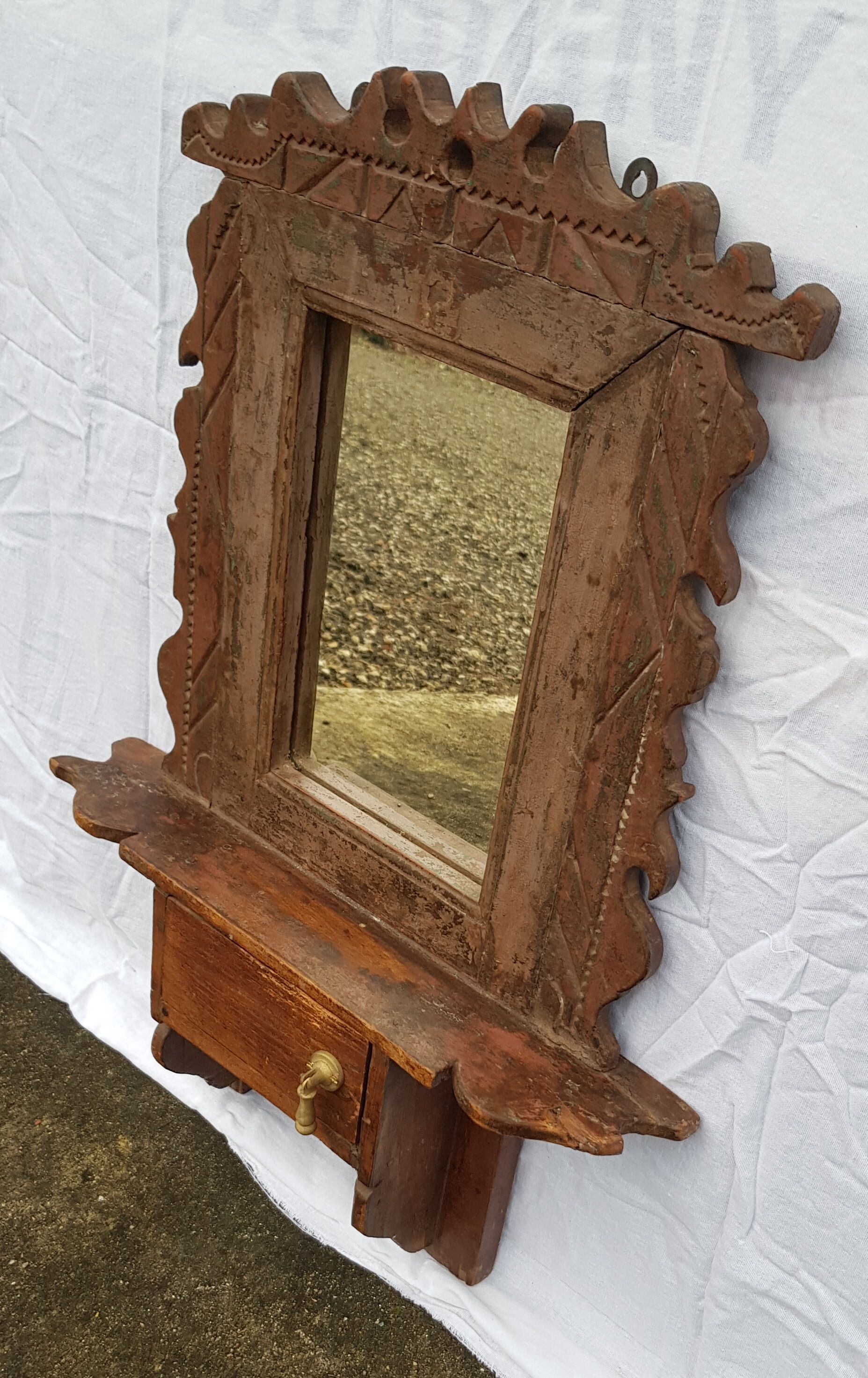 Old barber's mirror in teak