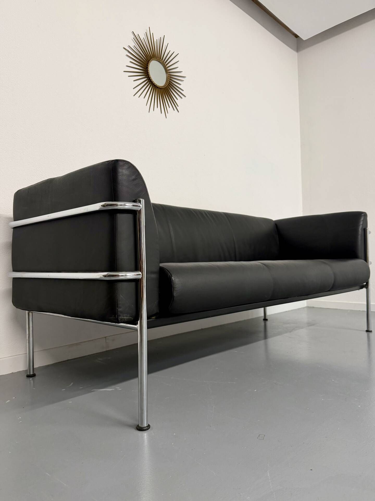 Three-seater tubular chrome and black leather sofa by Kébé, Denmark 80