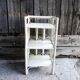 Antique white rattan bedside shelf
