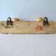 Coat rack with 2 wooden hooks imitating bamboo.