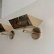 Pair of vintage adjustable solid brass wall lights France 1970