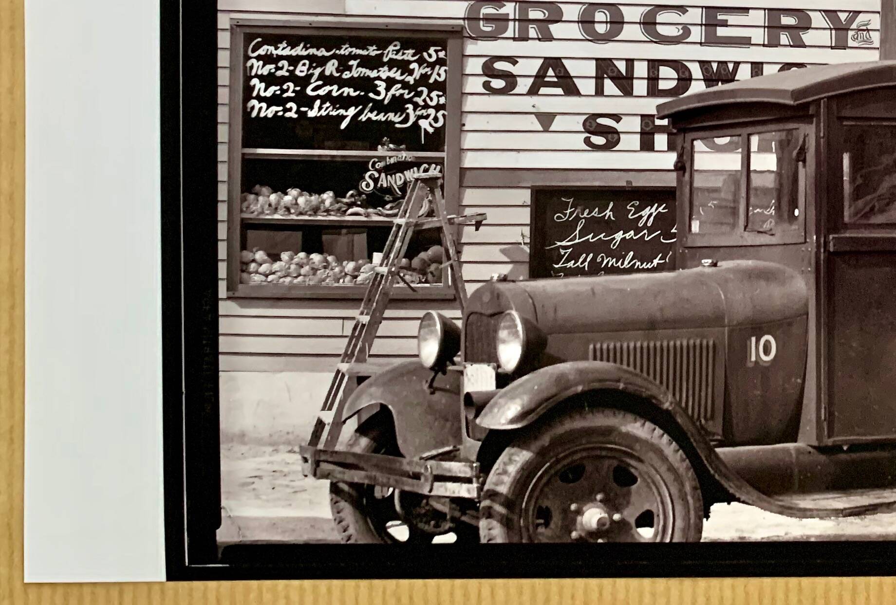 "Street corner in New Orleans, front of the NE Saul' sandwich shop
