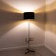 Black metal magazine rack floor lamp with ceramic shelf