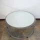 A round coffee table with a mirrored top, from the 1990s.