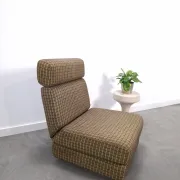 Vintage pull-out sofa bed, brown checked lounge chair with chrome.