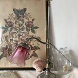 Antique jeweller's lamp, silver-plated base, frosted pink glass shade.