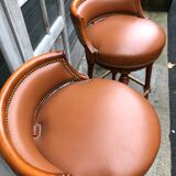 Pair of bar stools turning bar rests brass feet Hollywood Regency