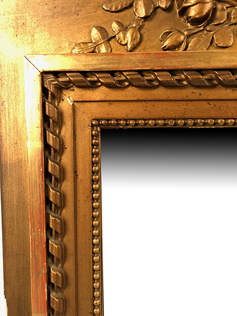 Louis XVI style trumeau in wood and gilded stucco and medallion engraving in the upper part