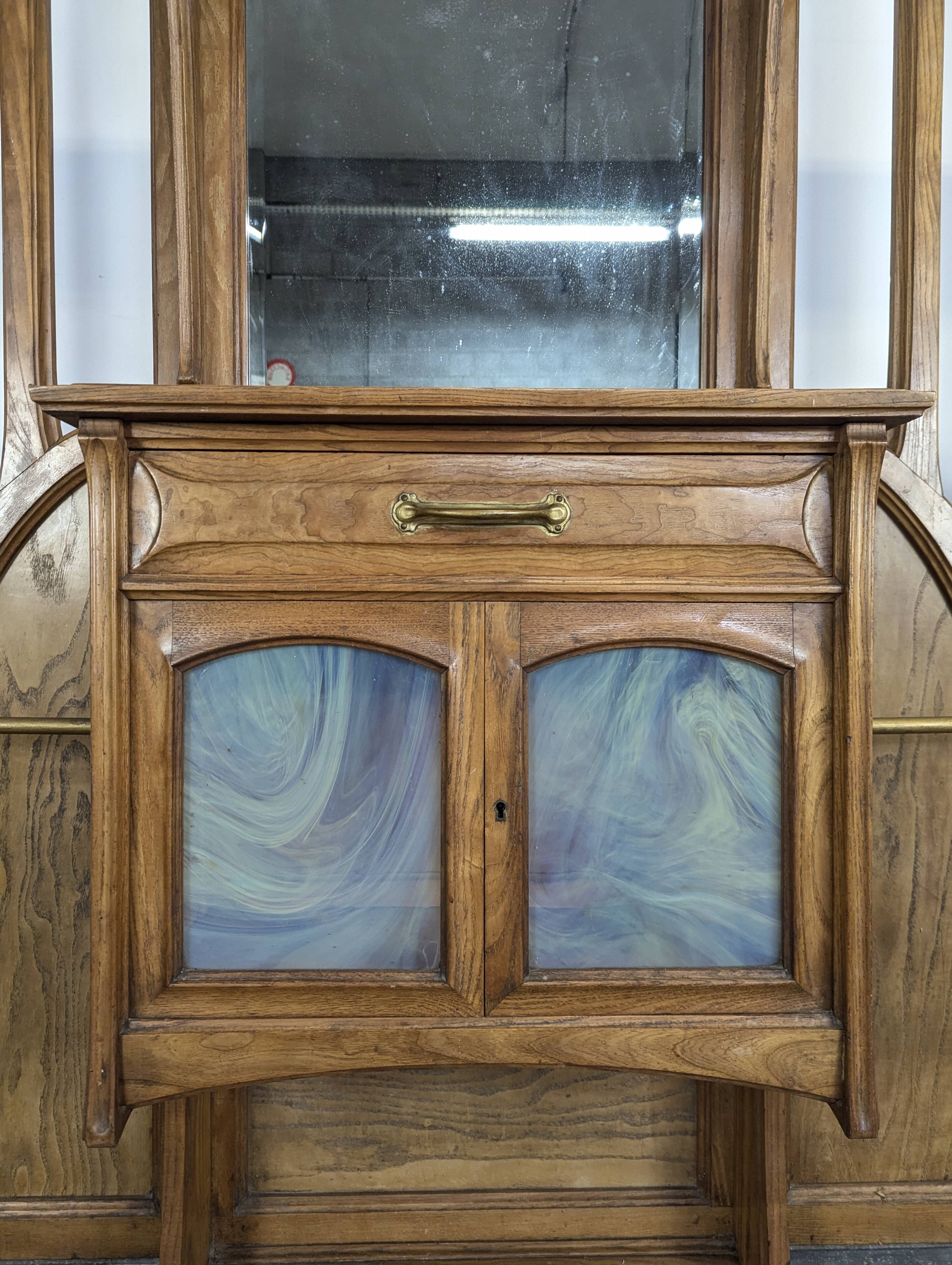 Large Art Nouveau cloakroom in the style of Van de Velde.