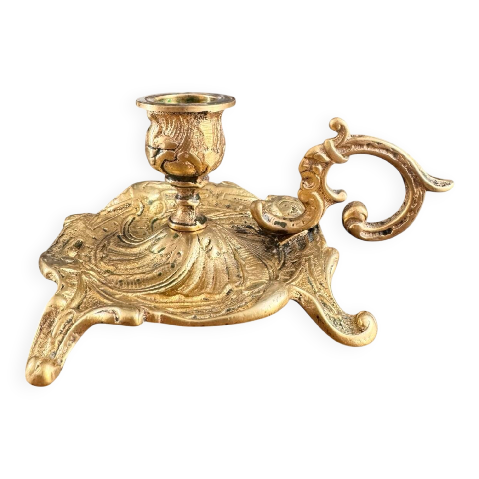 Antique hand candlestick in gilded bronze from the 19th century.