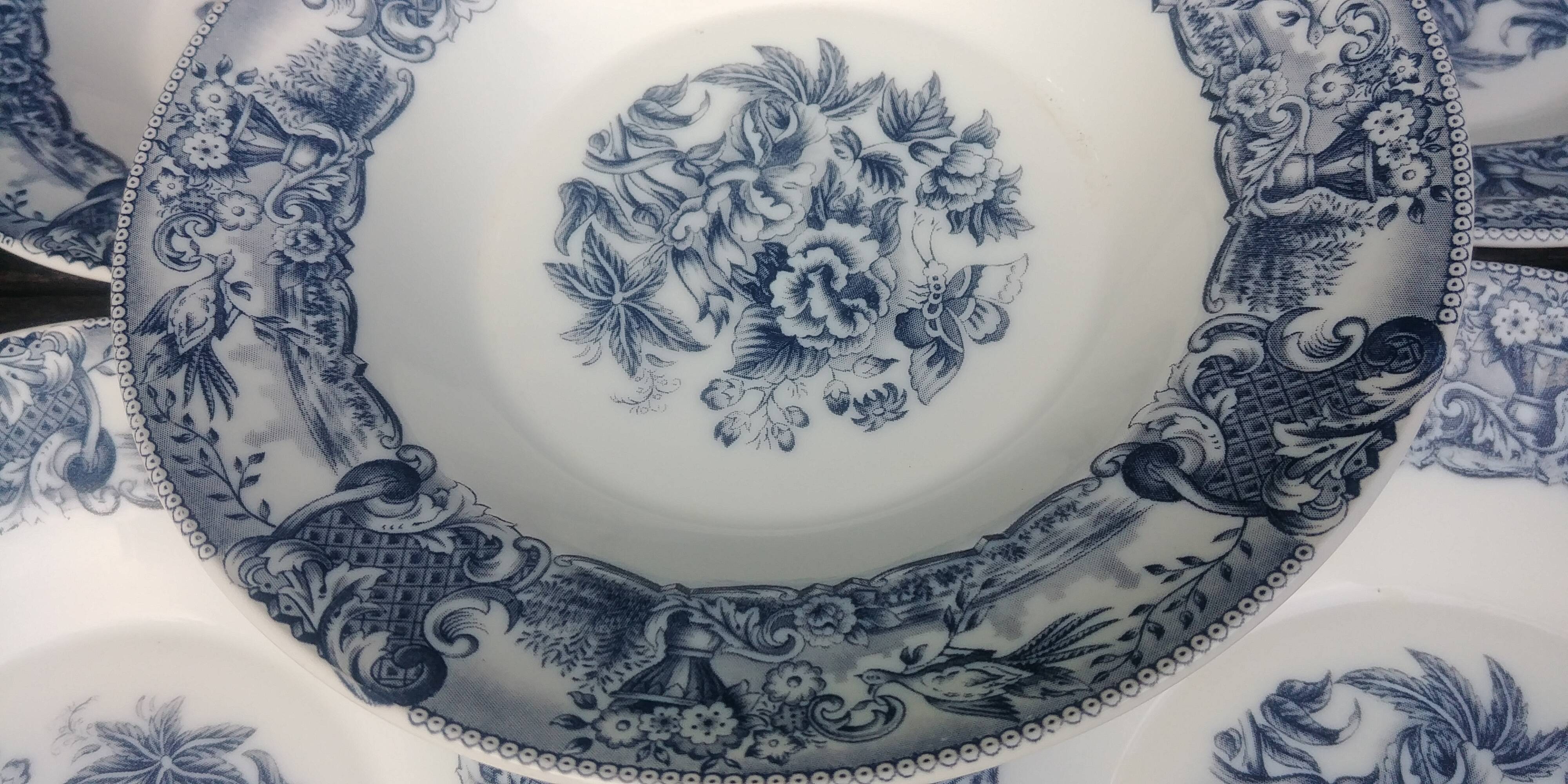 Set of eight hollow plates of the rivanel brand france baroque décor