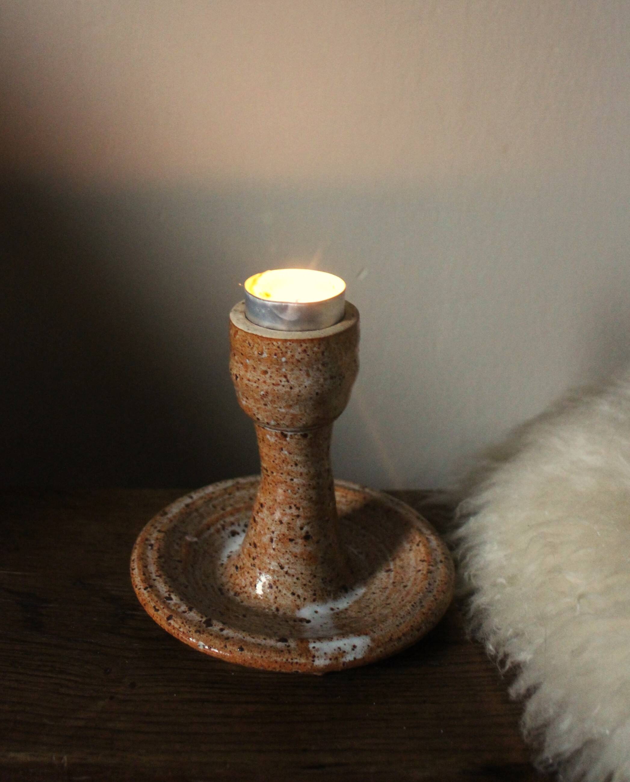 Vintage speckled rust round stoneware candlestick