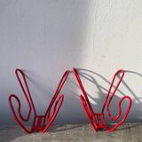 Pair of red metal wall hooks