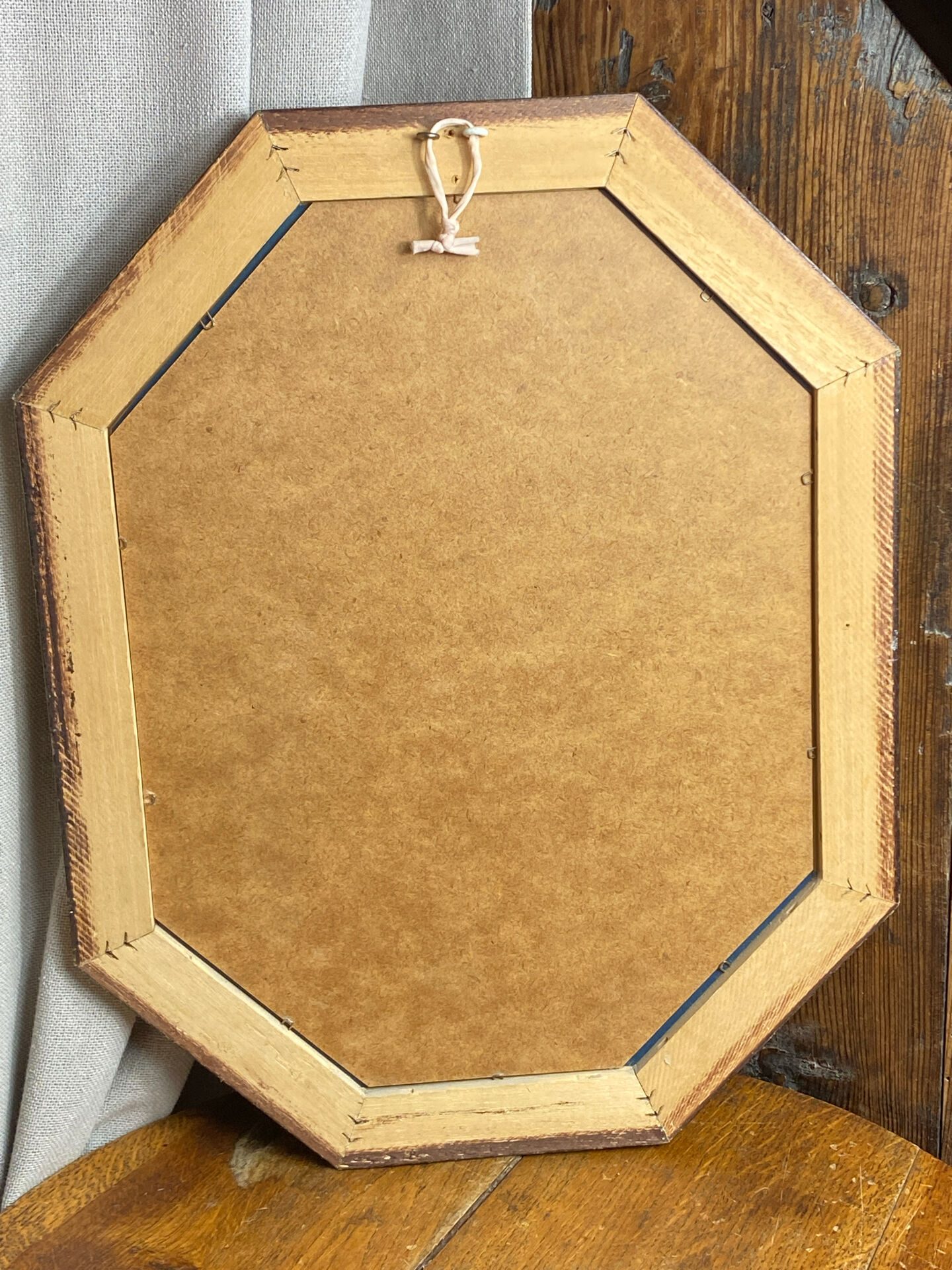 Miroir biseauté, de forme octogonale, en bois