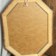 Miroir biseauté, de forme octogonale, en bois
