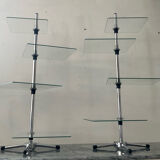 A pair of vintage side tables in glass and chrome metal.