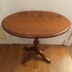 Oval pedestal table