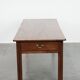 Antique French farmhouse table with two drawers and an extendable leaf.