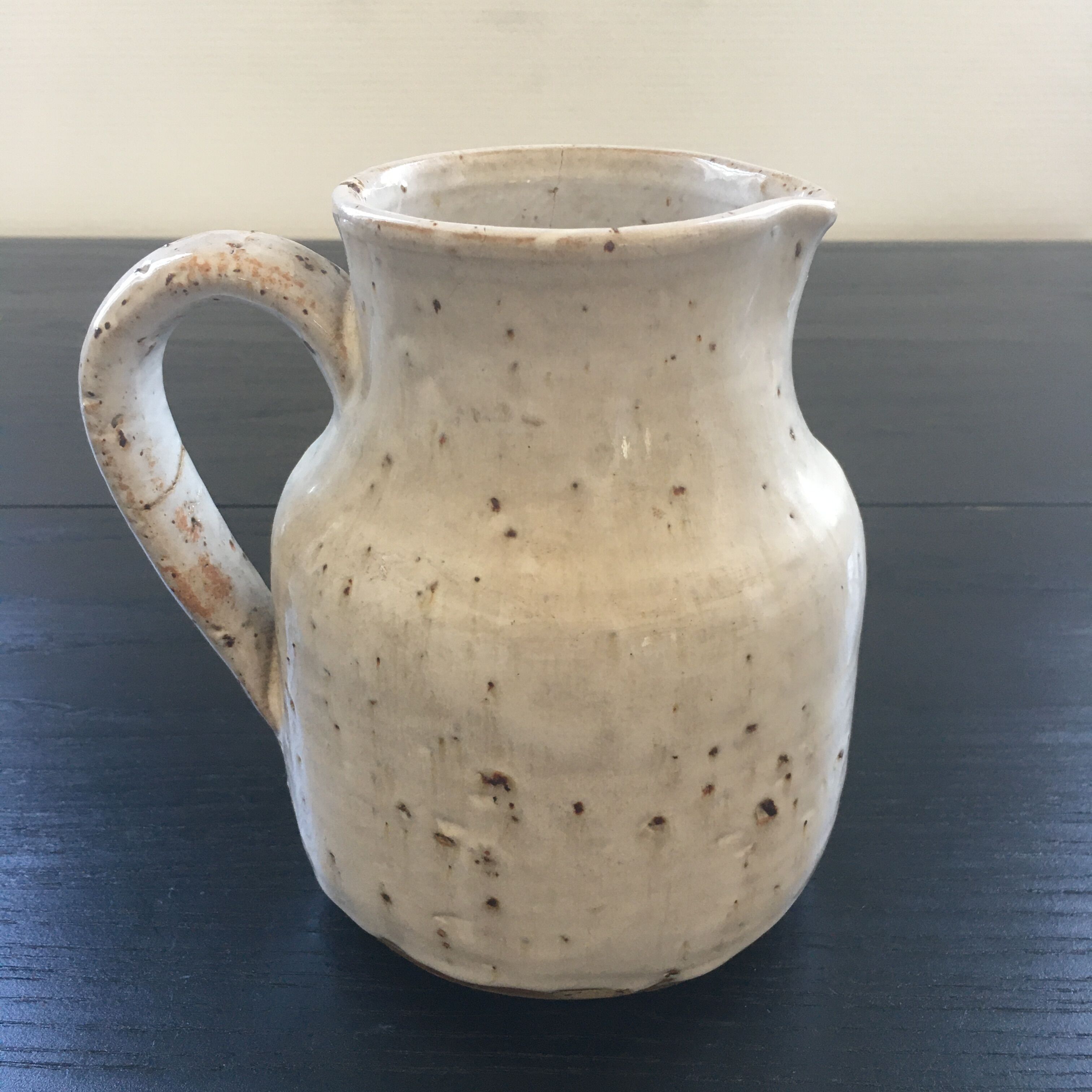 Old ivory stoneware jug
