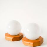Pair of globe wall lights in opaline with a pine base, 1980.