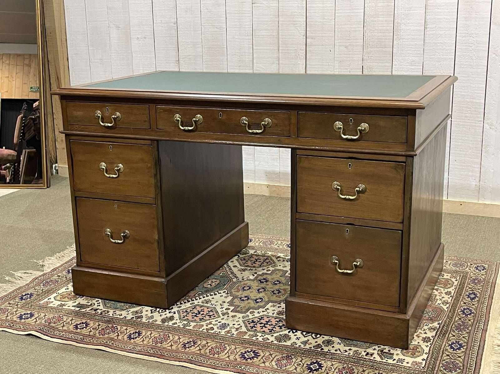 Late 19th century English mahogany desk with pedestals and leather top