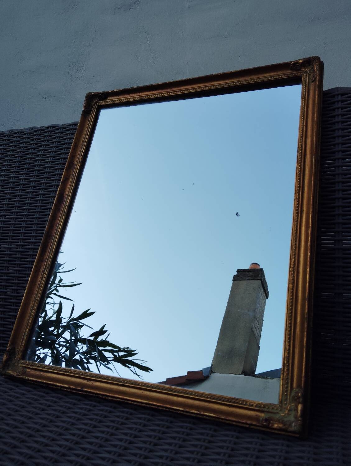 Miroir en bois, doré à la feuille d'or.