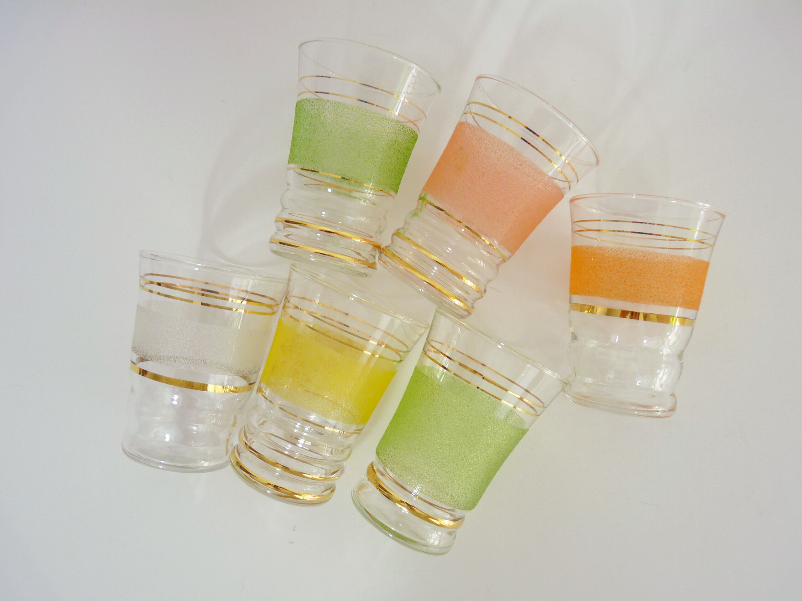6 old glasses in coloured granite glass and gold lise