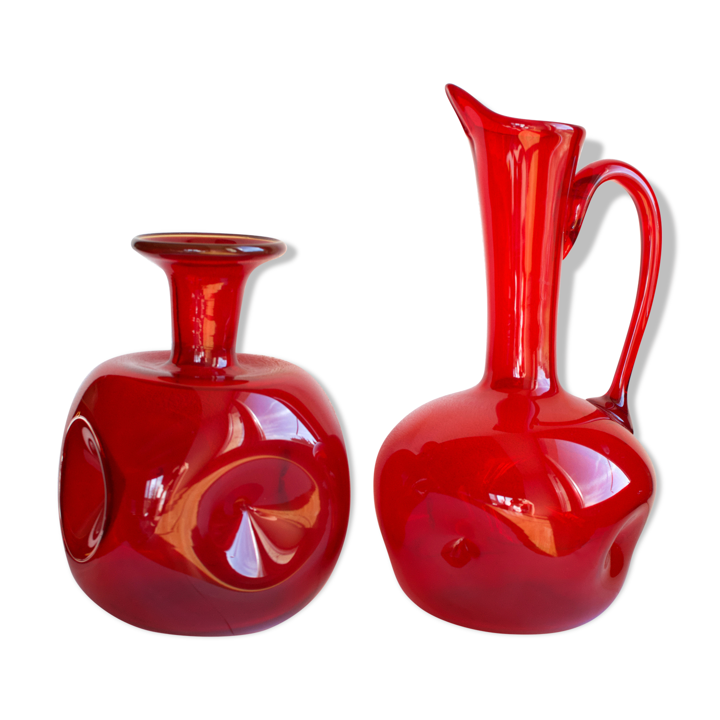 Pair of vintage blown glass pitchers