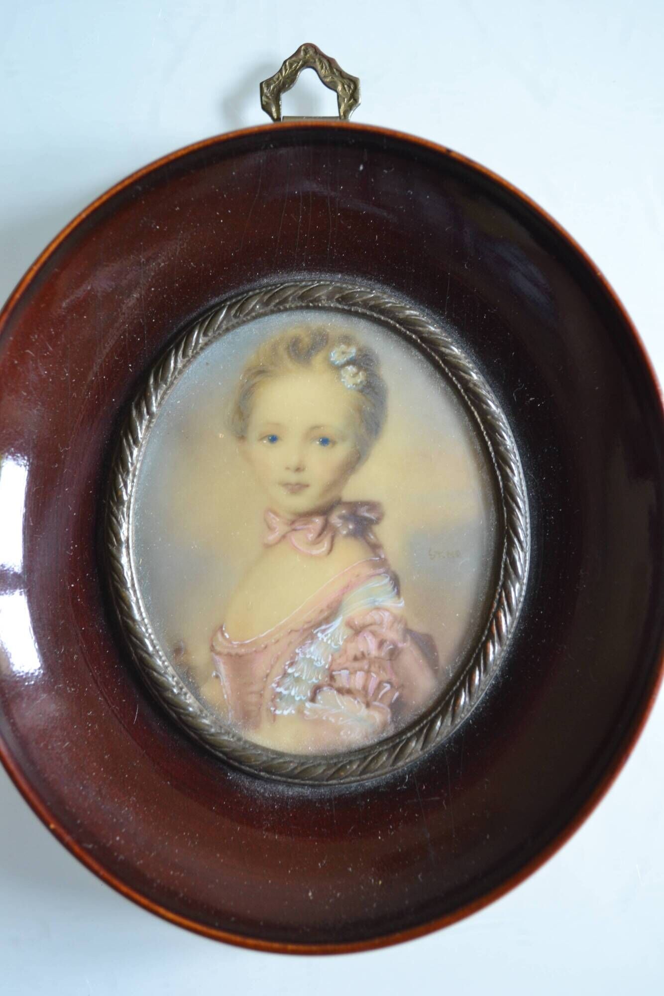Miniature portrait of a young girl, framed and under glass